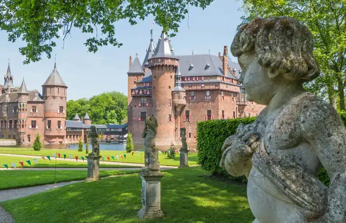 Cherub in the gardens of the medieval Dutch Castle de Haar in the province of Utrecht; Shutterstock ID 148639196