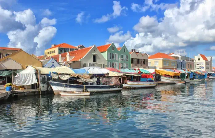 The so-called floating market at Willemstad, Curaçao is really an ordinary market on the waterfront manned by Venezuelan traders who moor their boats up against the stalls. It lies in the Punda district of Willemstad.