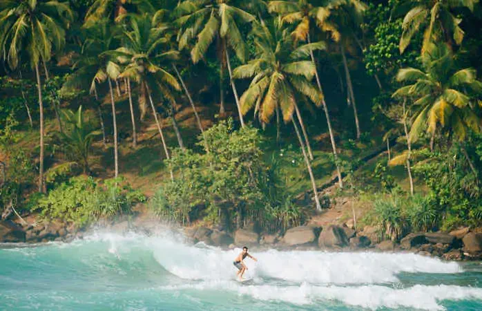 Surfers at Mirissa beach in Sri Lanka